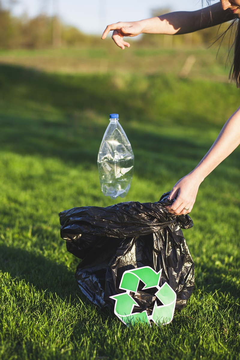 recycle-concept-with-woman-collecting-trash